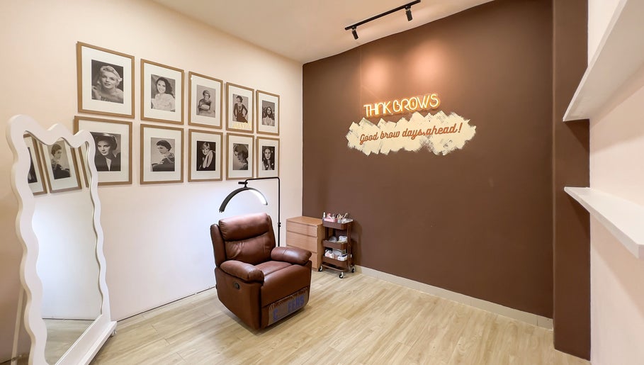 Chic brow salon interior at Sugarbombwax Medan, Sumatera Utara, ID with cozy chair and stylish decor.