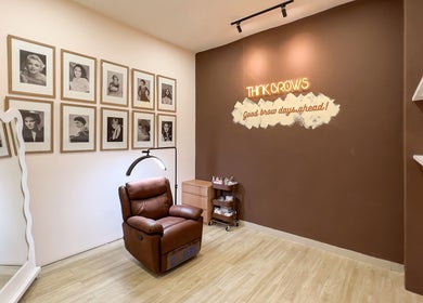 Chic brow salon interior at Sugarbombwax Medan, Sumatera Utara, ID with cozy chair and stylish decor.