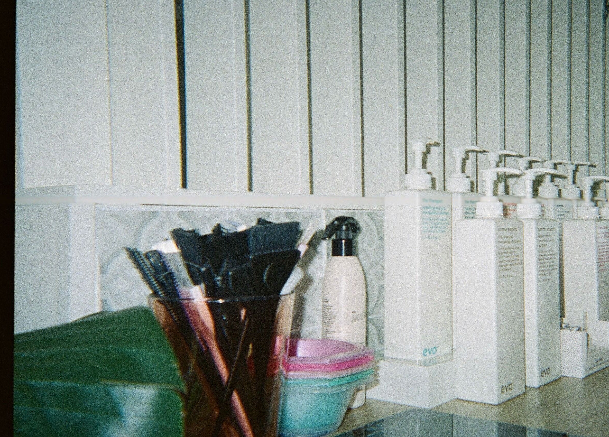 Beauty products and brushes displayed at Auréa Studios, Manly, New South Wales, AU.