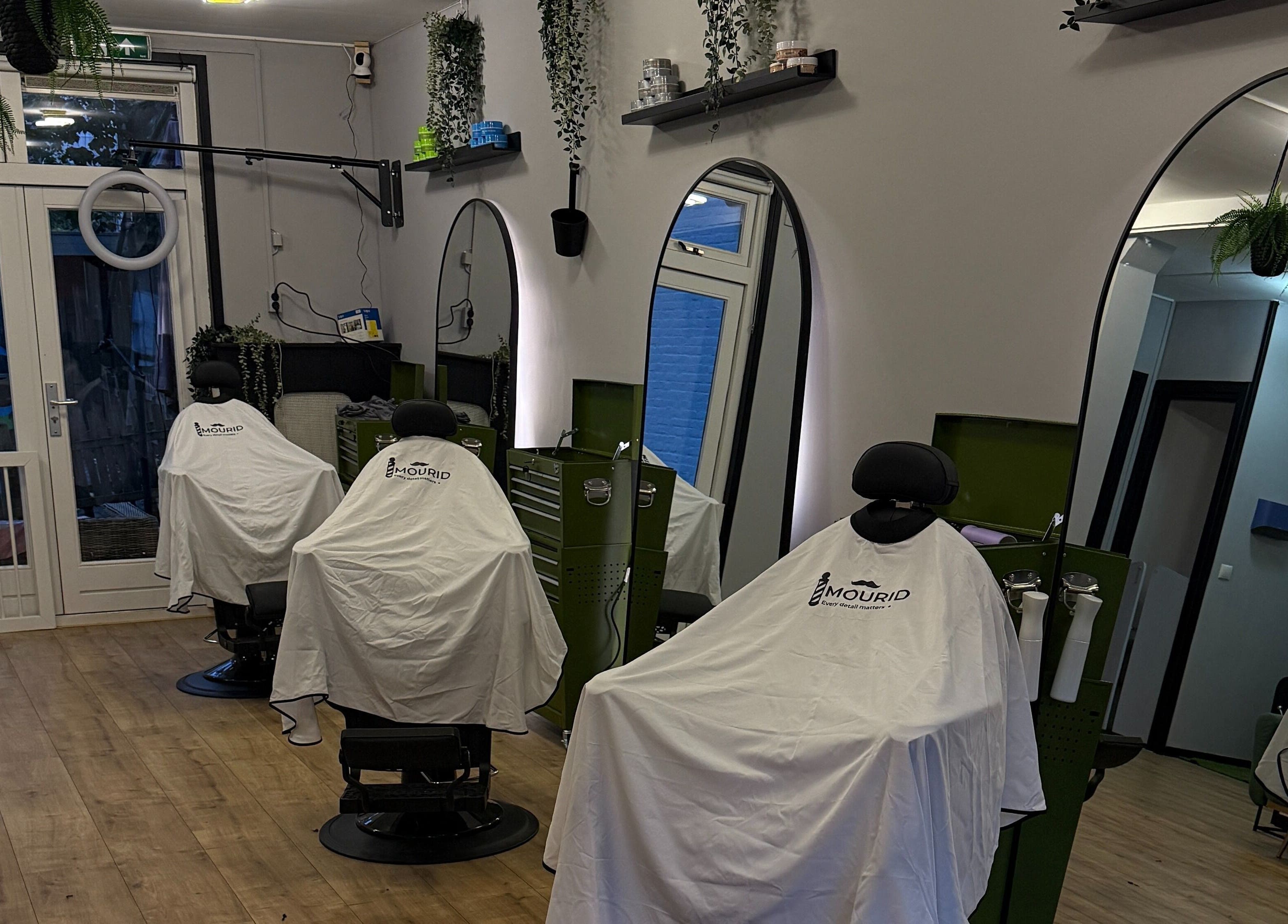 Modern barber chairs at Mourid Zuid in Amsterdam, Noord-Holland, NL, ready for clients.