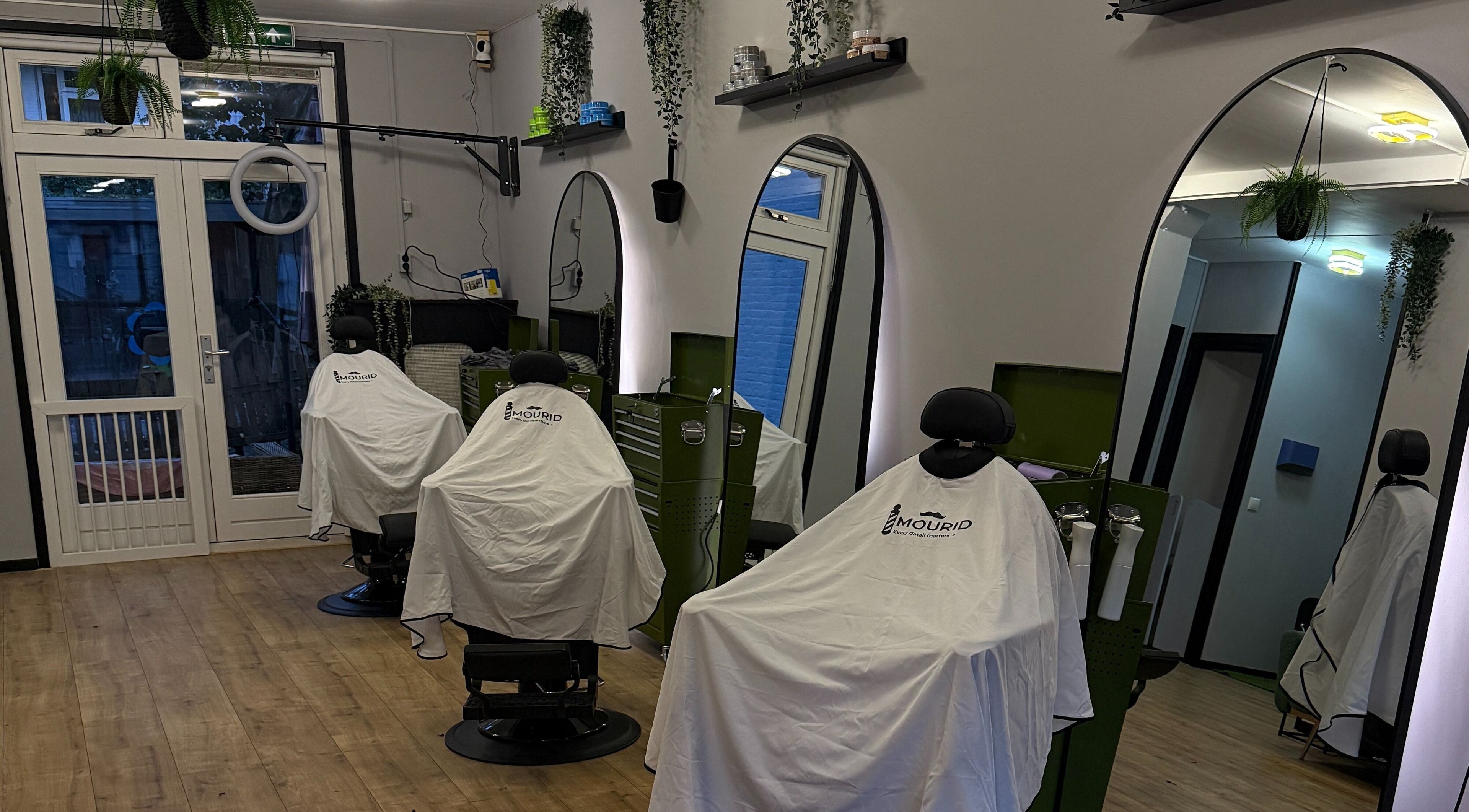 Modern barber chairs at Mourid Zuid in Amsterdam, Noord-Holland, NL, ready for clients.