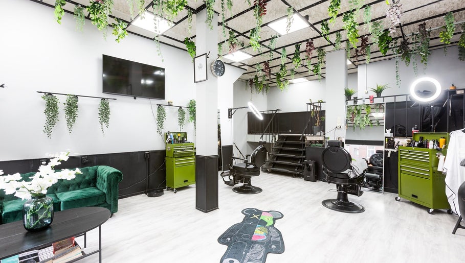 Modern interior of Mourid West in Amsterdam, Noord-Holland, NL with greenery and stylish decor.