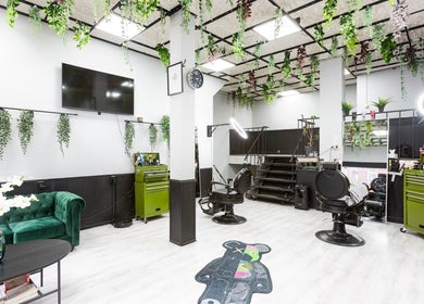 Modern interior of Mourid West in Amsterdam, Noord-Holland, NL with greenery and stylish decor.