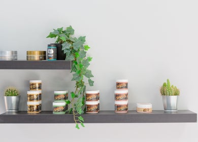 Beauty products and greenery displayed on a shelf at Mourid West, Amsterdam, Noord-Holland, NL.