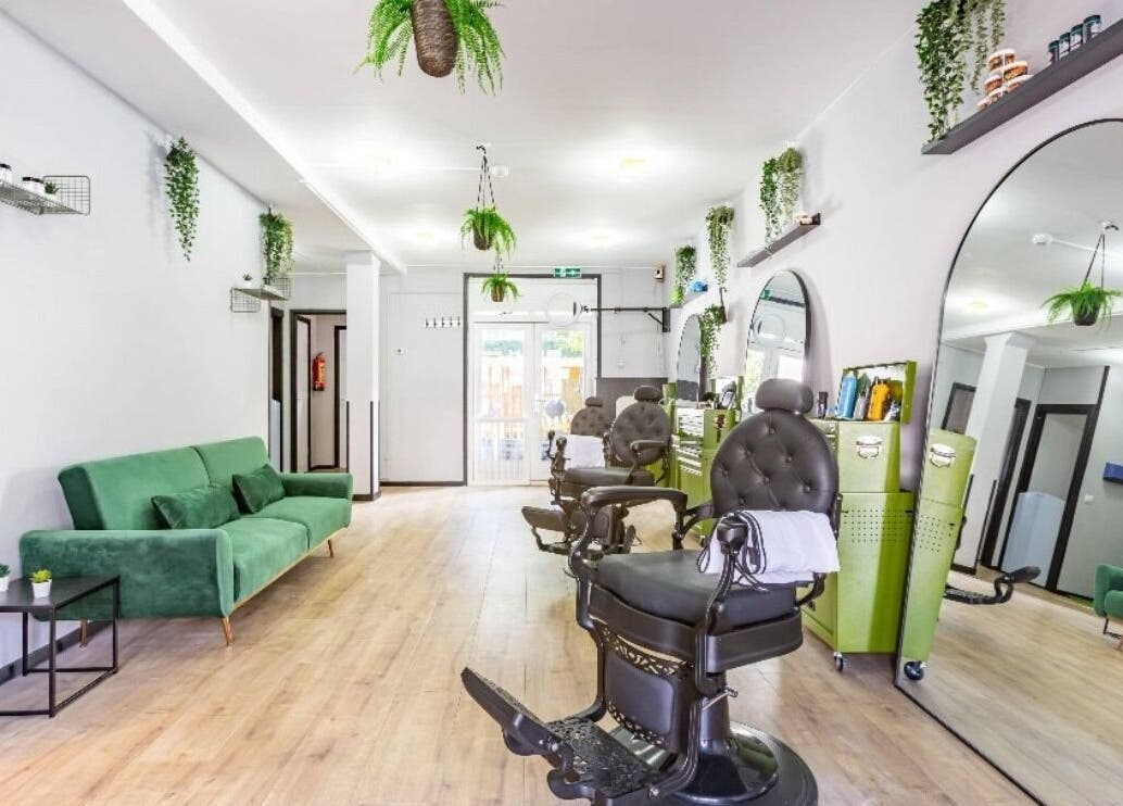 Contemporary salon interior at Mourid Zuid, Amsterdam, Noord-Holland, NL, featuring chic chairs and plants.