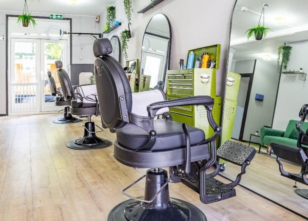 Modern salon chairs at Mourid Zuid, Amsterdam, Noord-Holland, NL, offering top-notch beauty services.