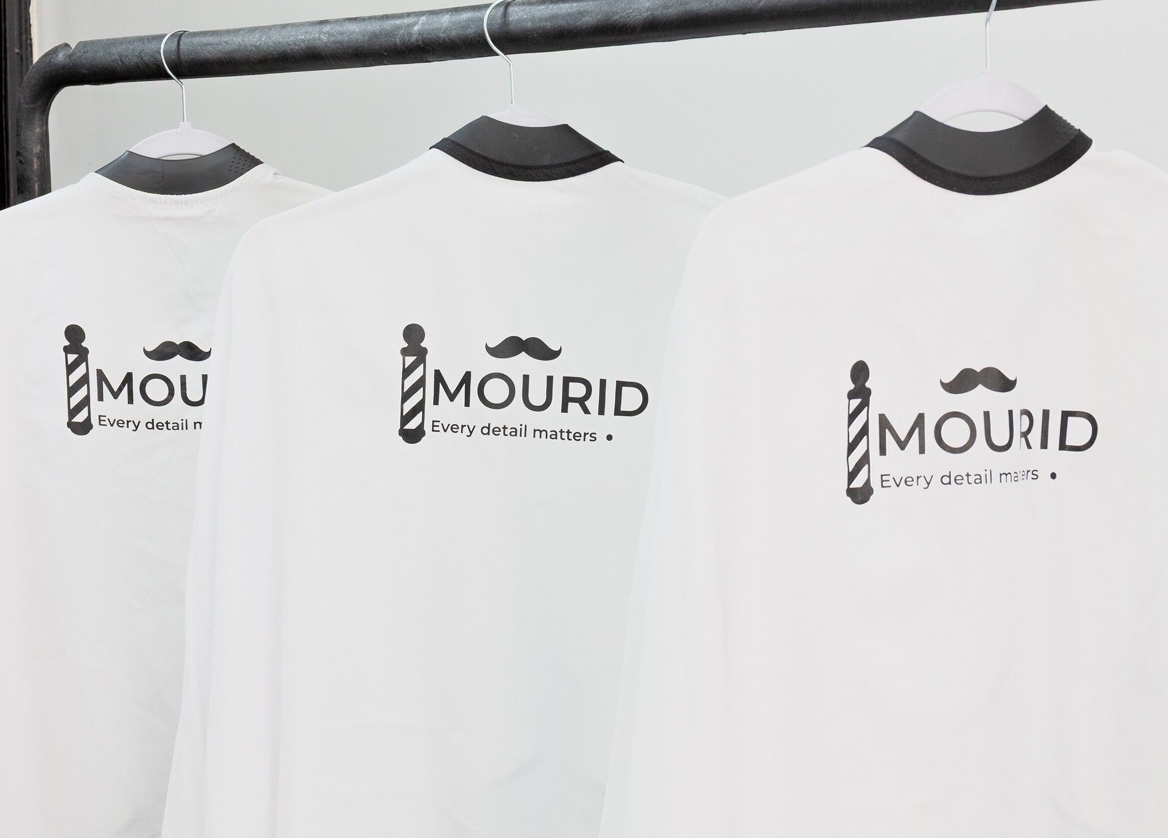 Mourid Zuid branded barber capes in Amsterdam, Noord-Holland, NL.