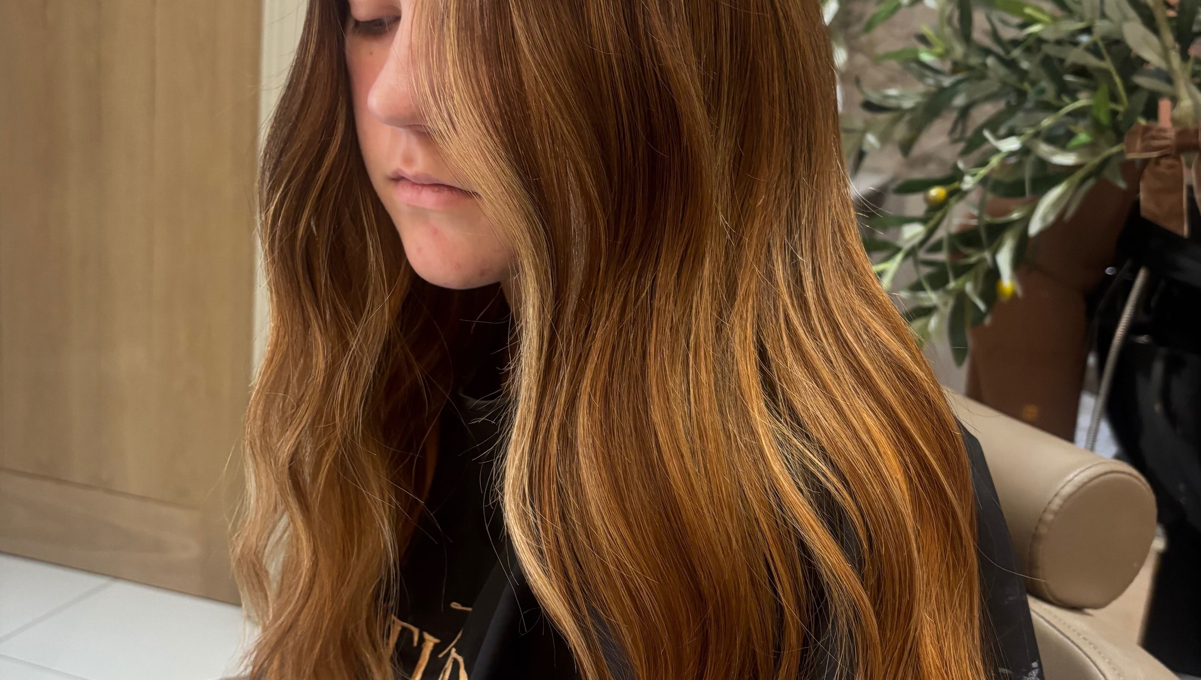 Long, wavy golden hair styled at Styled By Eve in Billingham, England, GB.