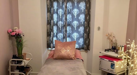 Relaxing treatment room at Heavenly Treatments with Hayleybell, Kelso, Scotland, GB, featuring a cozy bed and decor.