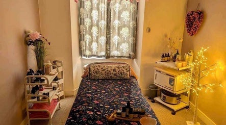 Cozy therapy room at Heavenly Treatments with Hayleybell, Kelso, Scotland, featuring soft lighting and calming decor.