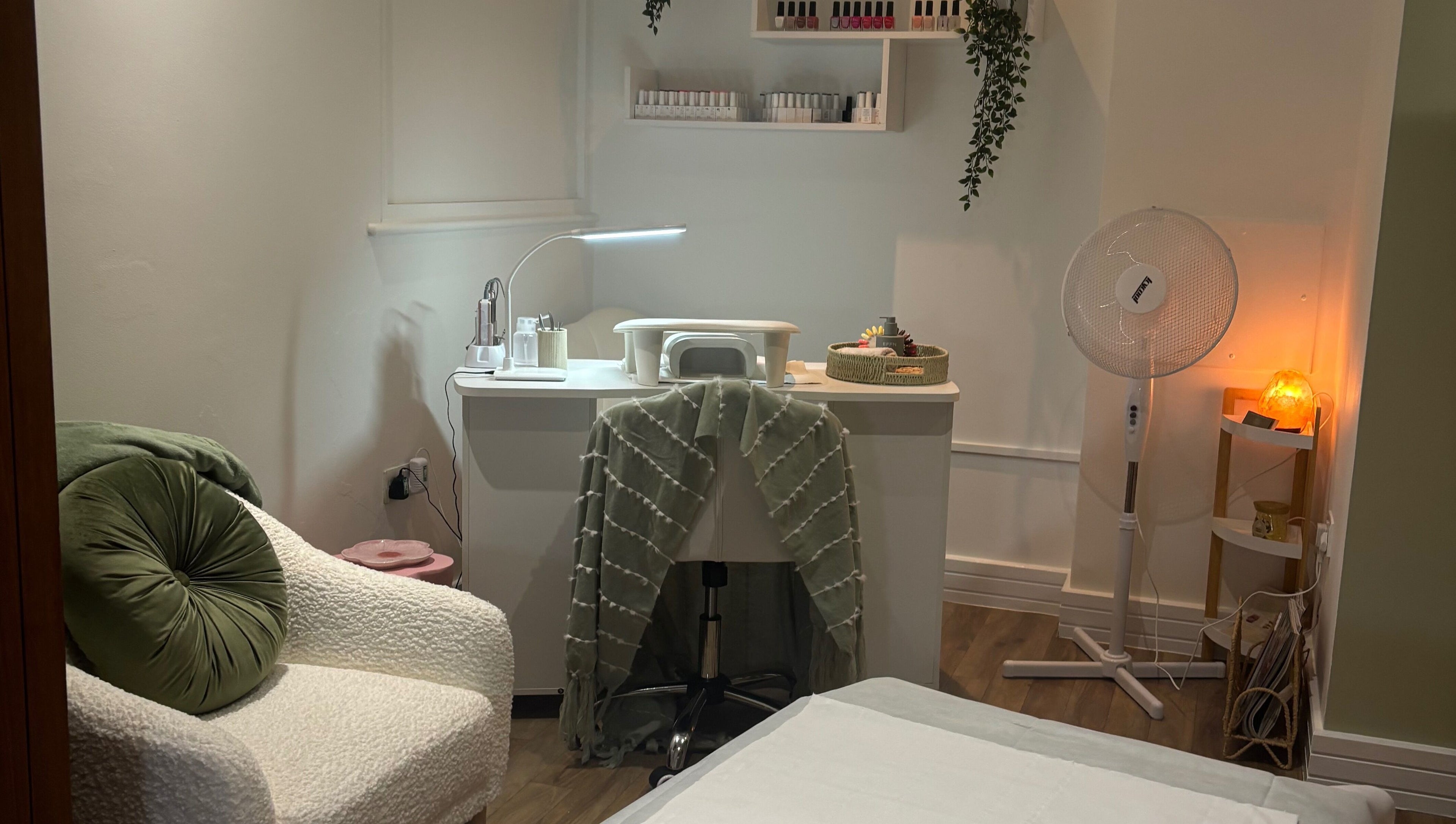 Mani’s by Millie May in Bridgend, Wales, GB offers a cozy beauty space with plush seating and a nail station.