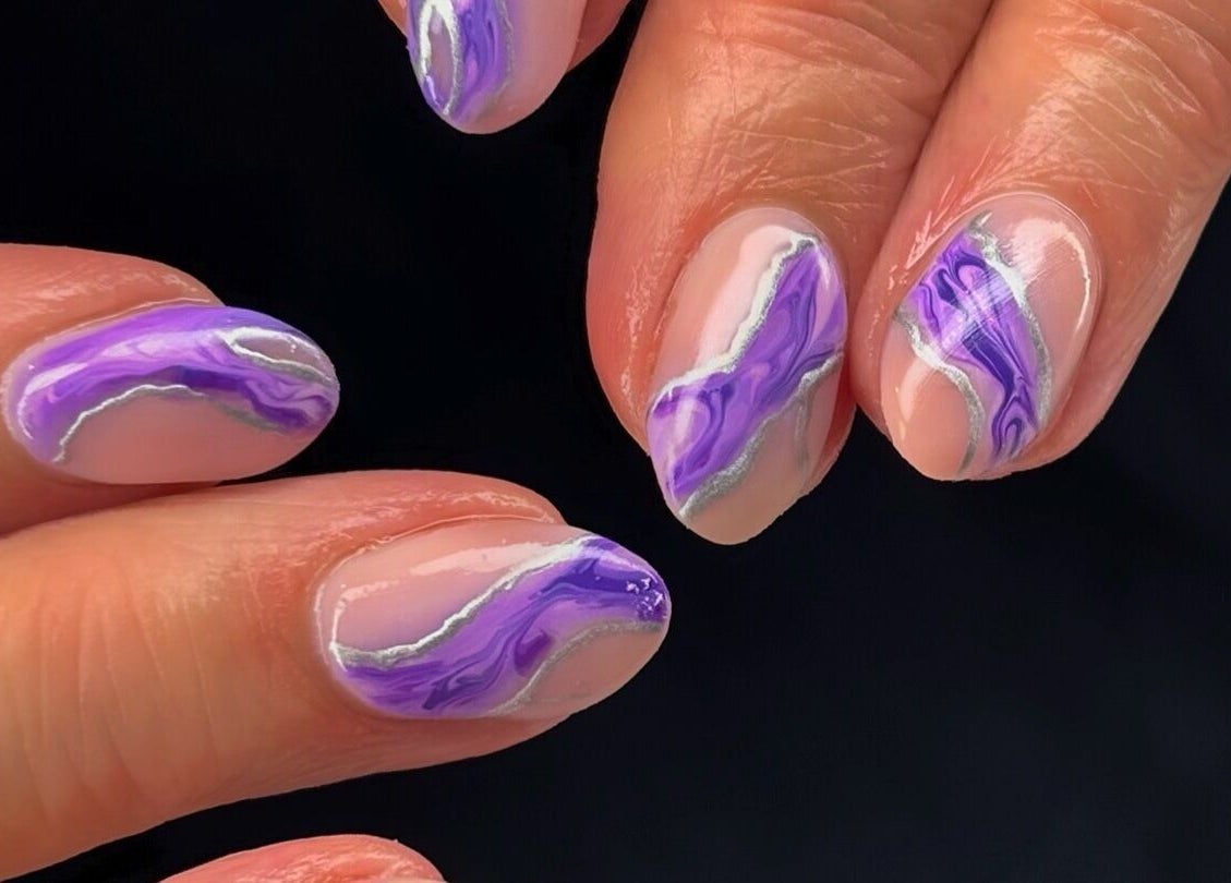 Elegant purple marble nails at Mani’s by Millie May, Bridgend, Wales, GB, showcasing intricate nail art.