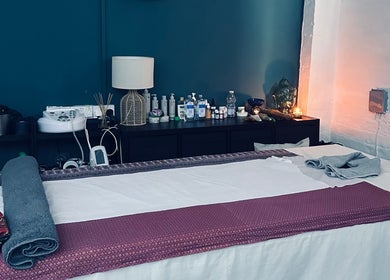 Tranquil massage room setup at Afon Thai Massage, Cardiff, Wales, GB, showcasing relaxing ambiance.