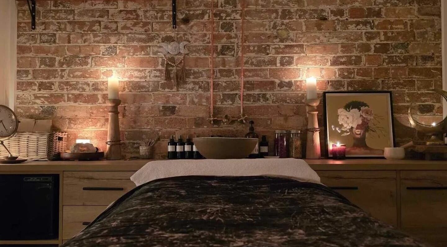 Relaxing spa treatment room at Maise Ri Anam, Toowoomba City, Queensland with candles and serene decor.