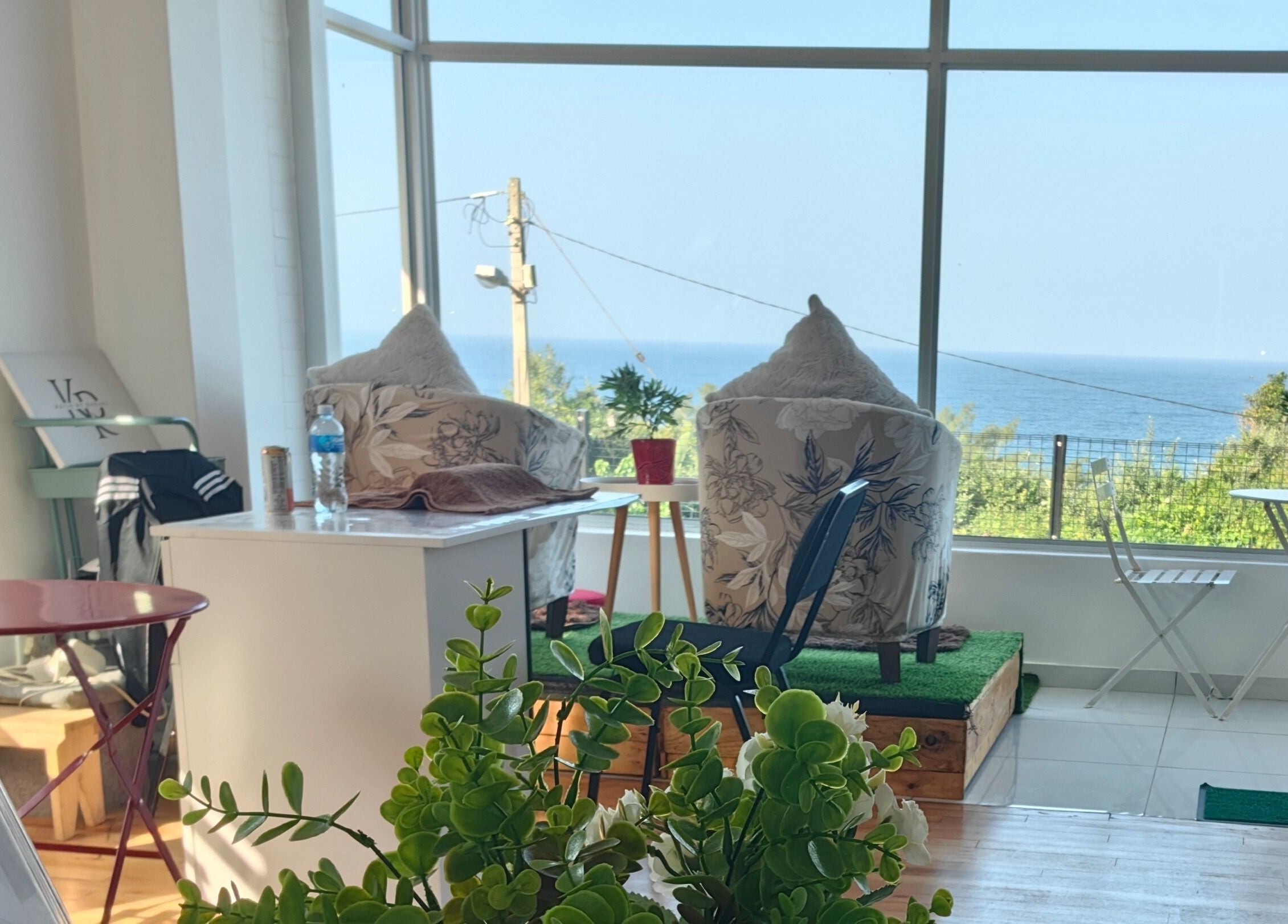 Relaxing lounge at Jenny's wellness center in Amanzimtoti, Kwazulu-natal, ZA with ocean views and cozy seating.