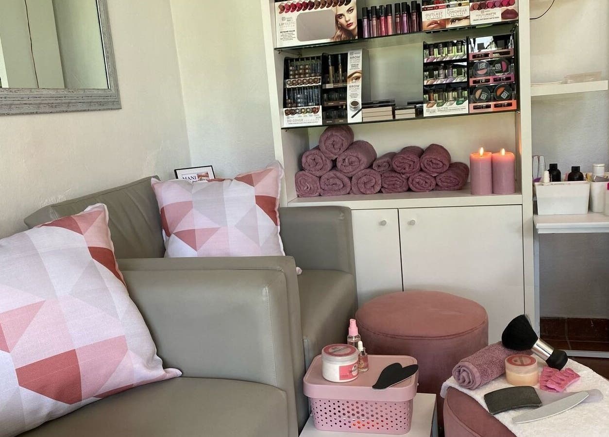 Cozy corner at The Vanity Suite, Pretoria, Gauteng, ZA with plush seating and beauty products.