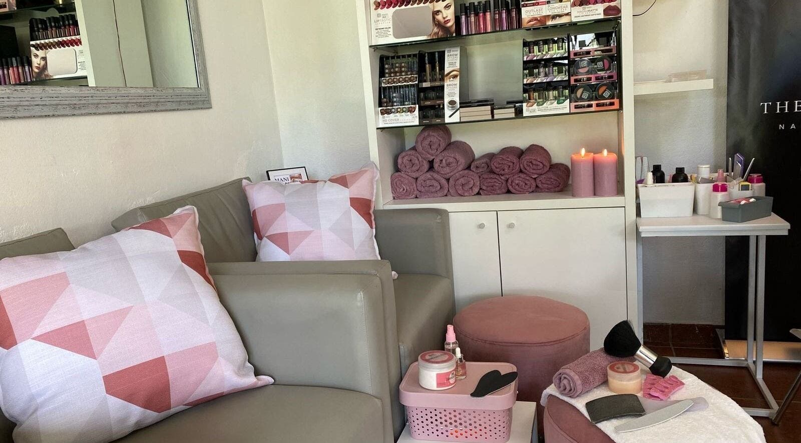 Cozy corner at The Vanity Suite, Pretoria, Gauteng, ZA with plush seating and beauty products.