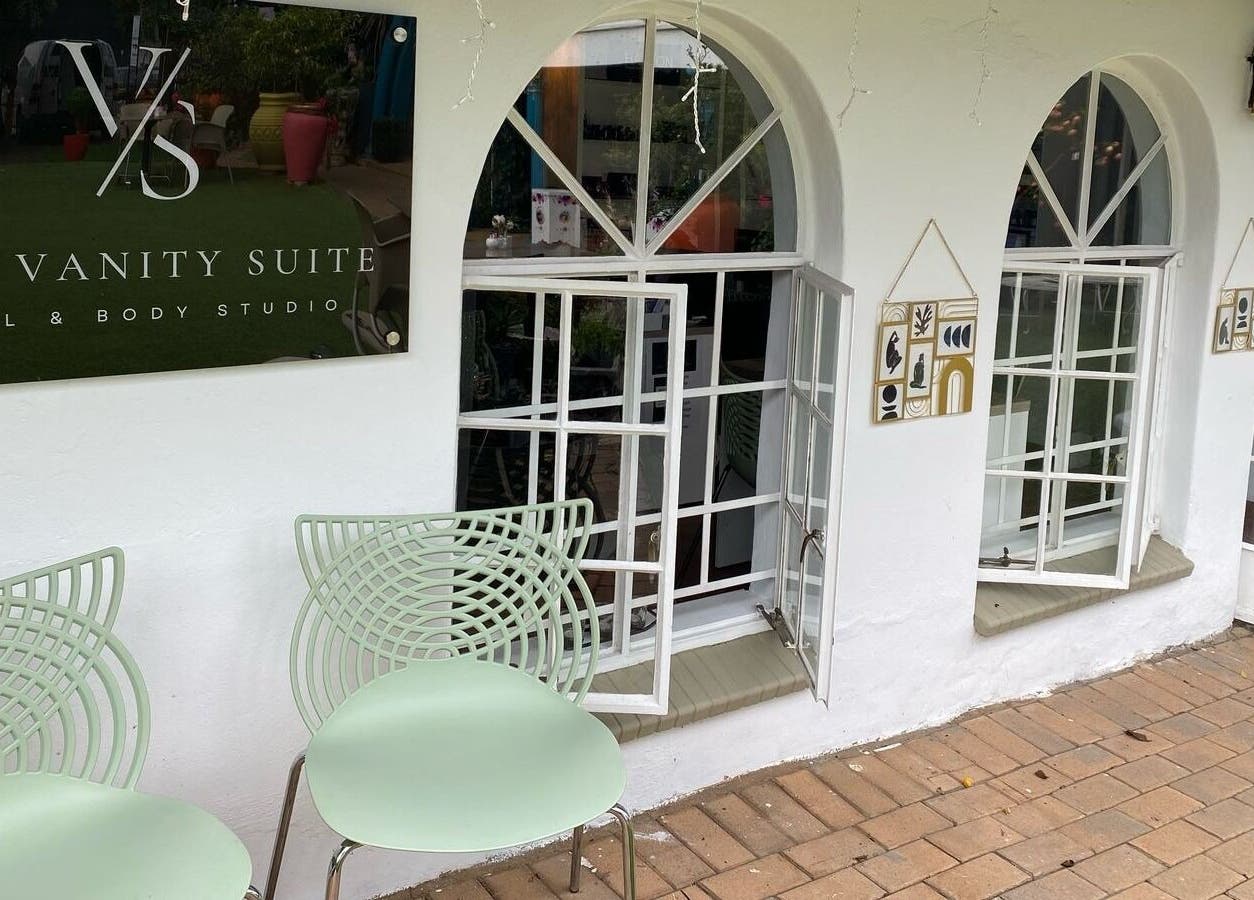 Entrance of The Vanity Suite with stylish chairs in Pretoria, Gauteng, ZA.