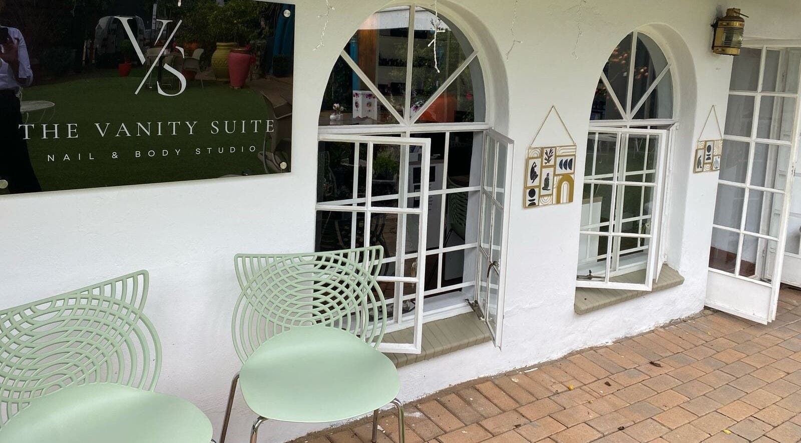 Entrance of The Vanity Suite with stylish chairs in Pretoria, Gauteng, ZA.