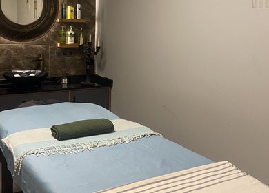 Peaceful massage room at Fey Massage And Spa, İstanbul, İstanbul, TR with a cozy massage table.