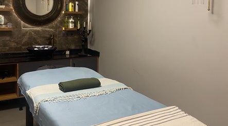 Peaceful massage room at Fey Massage And Spa, İstanbul, İstanbul, TR with a cozy massage table.