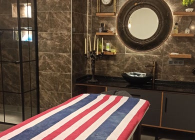 Relaxing massage room at Fey Massage And Spa, İstanbul, İstanbul, TR, featuring chic decor and a cozy setup.