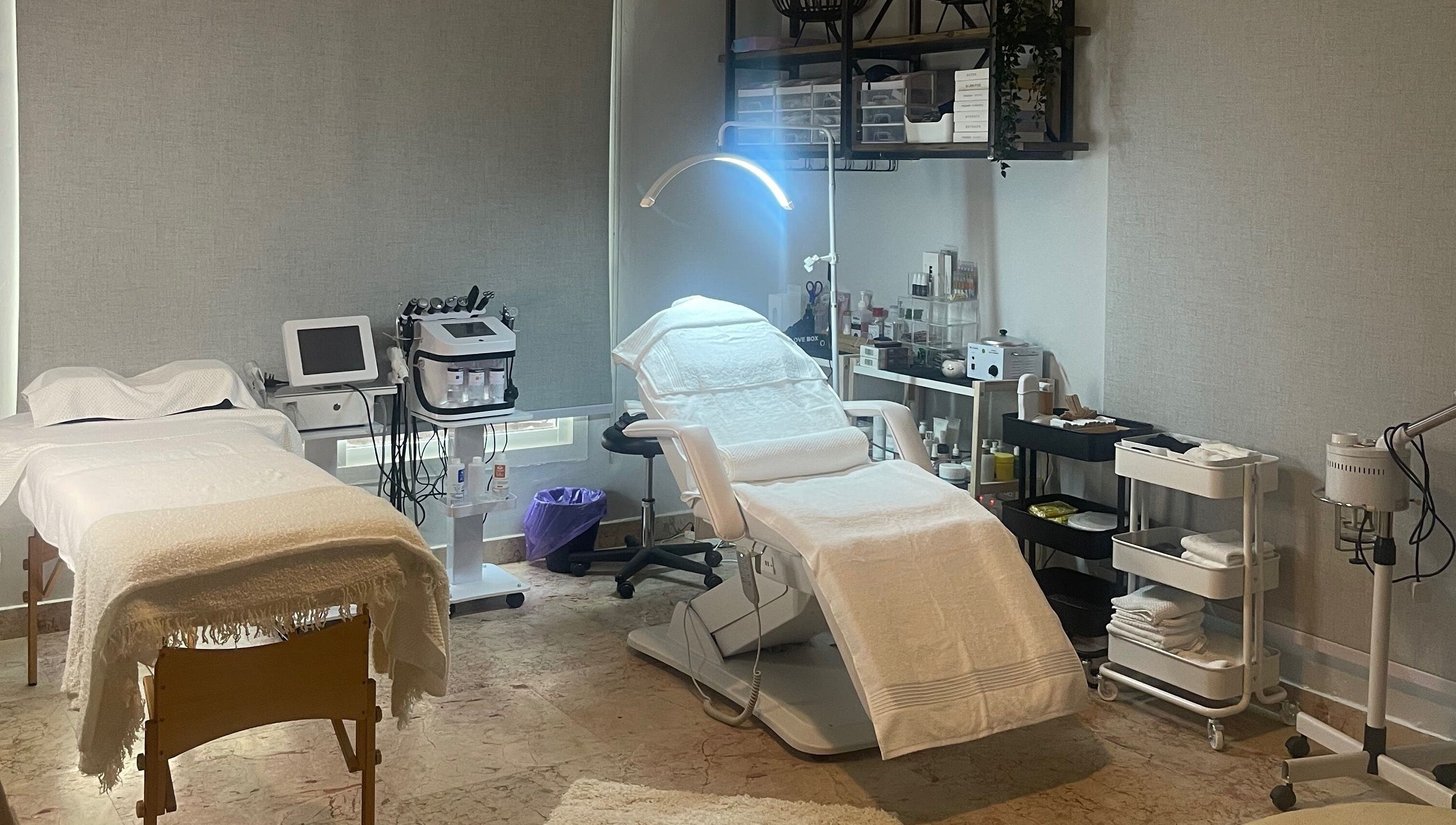 Treatment room at Studio M Aesthetics Clinic in Abu Dhabi, Abu Dhabi, AE with spa beds and equipment.
