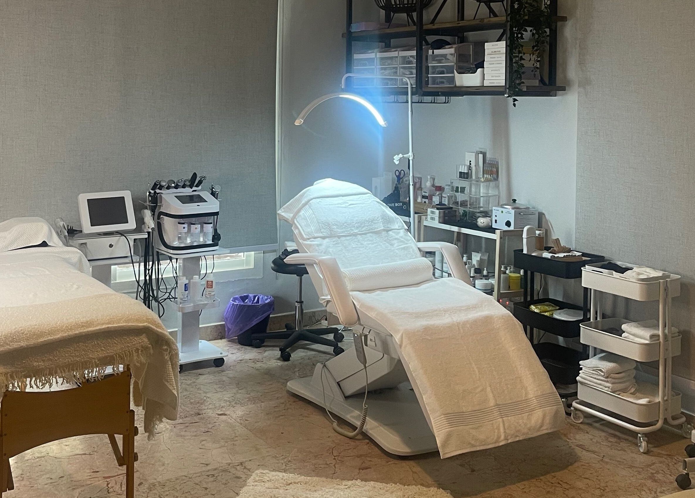 Treatment room at Studio M Aesthetics Clinic in Abu Dhabi, Abu Dhabi, AE with spa beds and equipment.