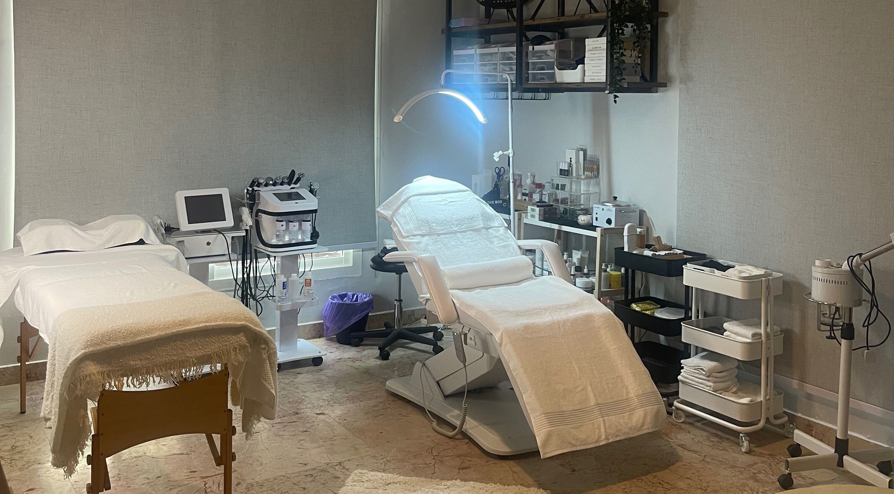 Treatment room at Studio M Aesthetics Clinic in Abu Dhabi, Abu Dhabi, AE with spa beds and equipment.