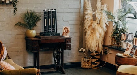 Cozy corner in House of Swain HAIR & EXTENSION SALON, Whitehaven, England, GB, featuring elegant decor and plants.