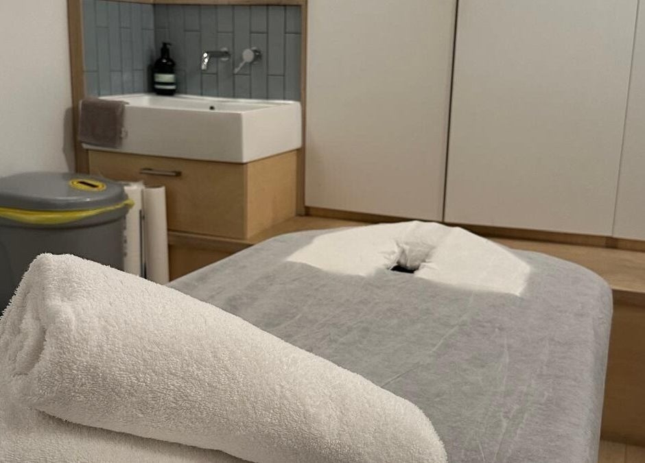 Massage table with fresh towels at JM Massage Therapy, London, England, GB offering relaxation and comfort.