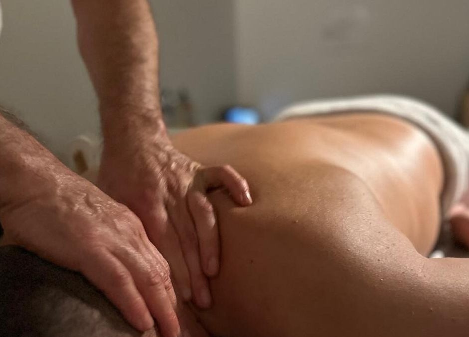 Relaxing massage session at JM Massage Therapy, London, England, GB, highlighting expert hand techniques.