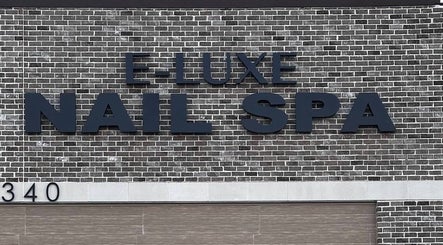Q @ E-Luxe Nail Spa signage on brick exterior in League City, Texas, US.