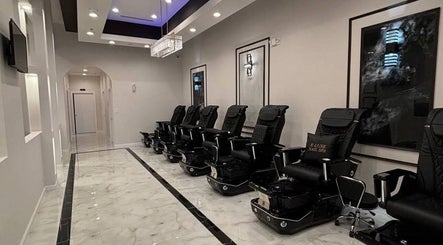 Sleek pedicure chairs at Q @ E-Luxe Nail Spa, League City, Texas. Relaxing ambiance with modern decor.