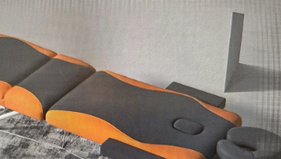 A modern massage table at Healing Hands Therapy, Stafford, England, GB, set for a relaxing therapy session.