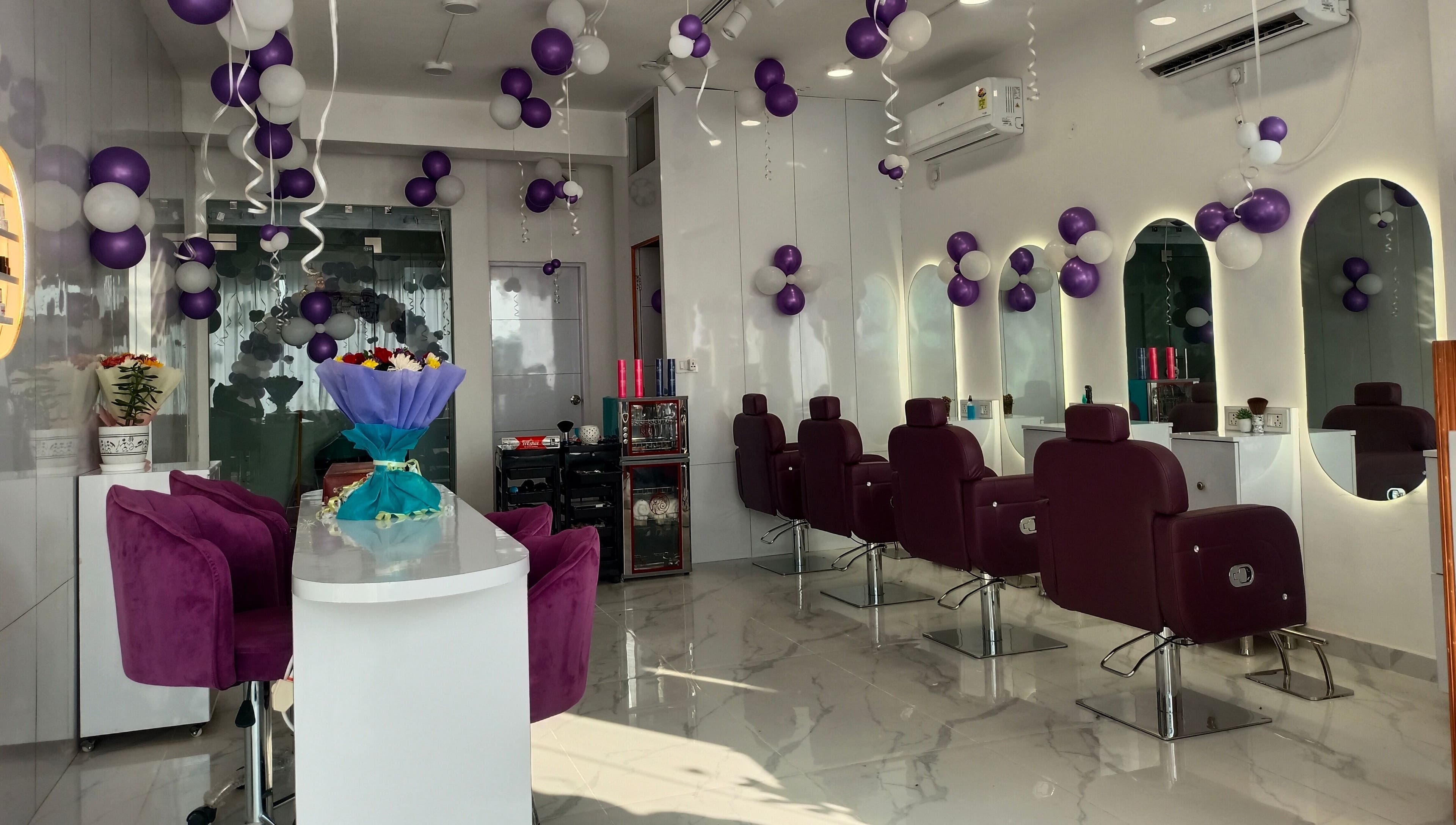 Stylish salon interior at Belles & Beaus, Dehradun, Uttarakhand, IN showcasing chic seating and decor.