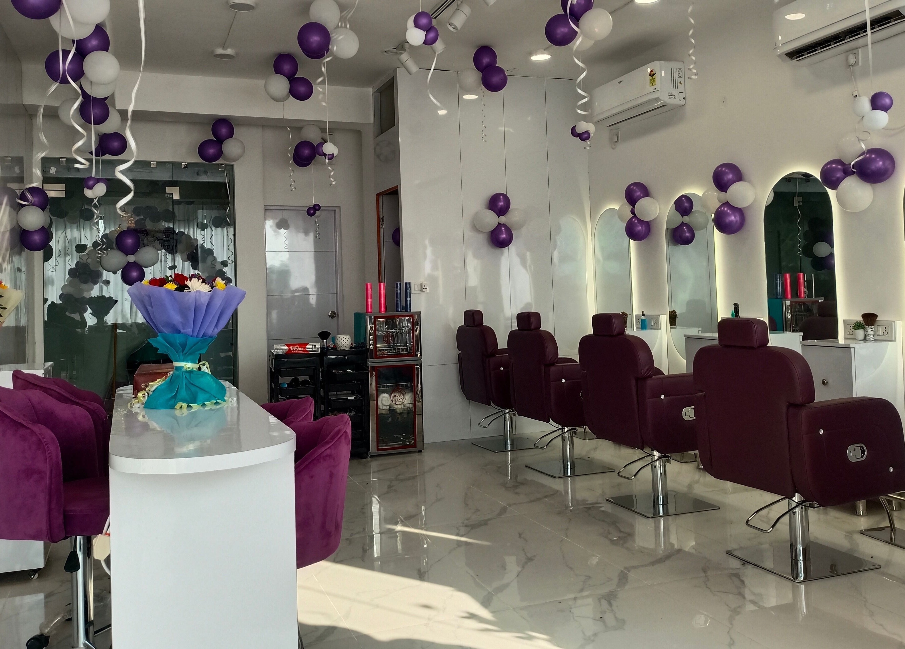 Stylish salon interior at Belles & Beaus, Dehradun, Uttarakhand, IN showcasing chic seating and decor.