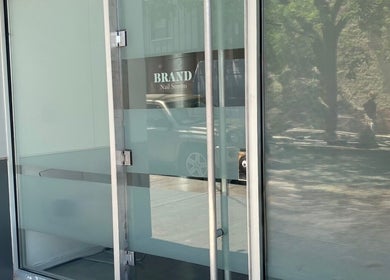 Glass door entrance of Brand Nail Studio, Philadelphia, Pennsylvania, US.