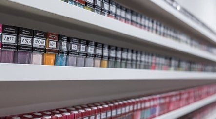 Colorful nail polish bottles lined up at Brand Nail Studio in Philadelphia, Pennsylvania, US.
