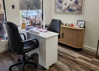 Elegant nail station at Purple Nail, Montgomery, Texas, US featuring comfortable chairs and modern decor.