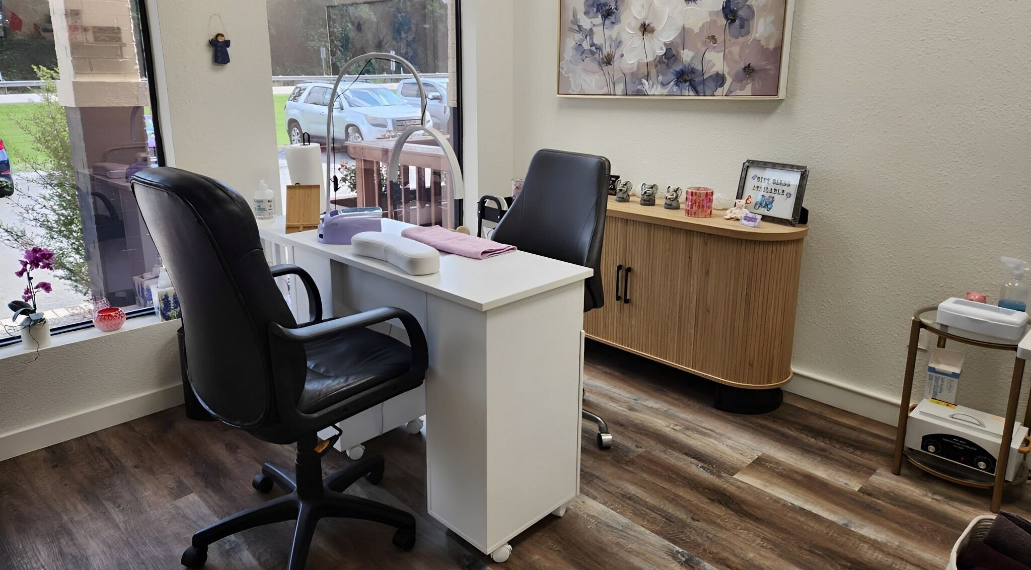 Elegant nail station at Purple Nail, Montgomery, Texas, US featuring comfortable chairs and modern decor.