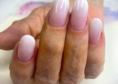 Beautiful ombre nails at Purple Nail, Montgomery, Texas, US showcasing a sophisticated style.