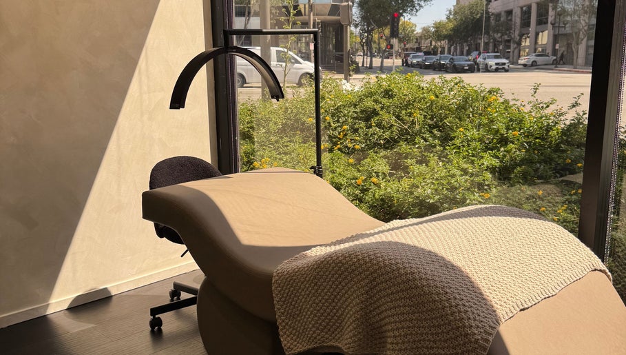 Relaxing treatment bed at Beauté De Mart, bathed in sunlight, Glendale, California, US.