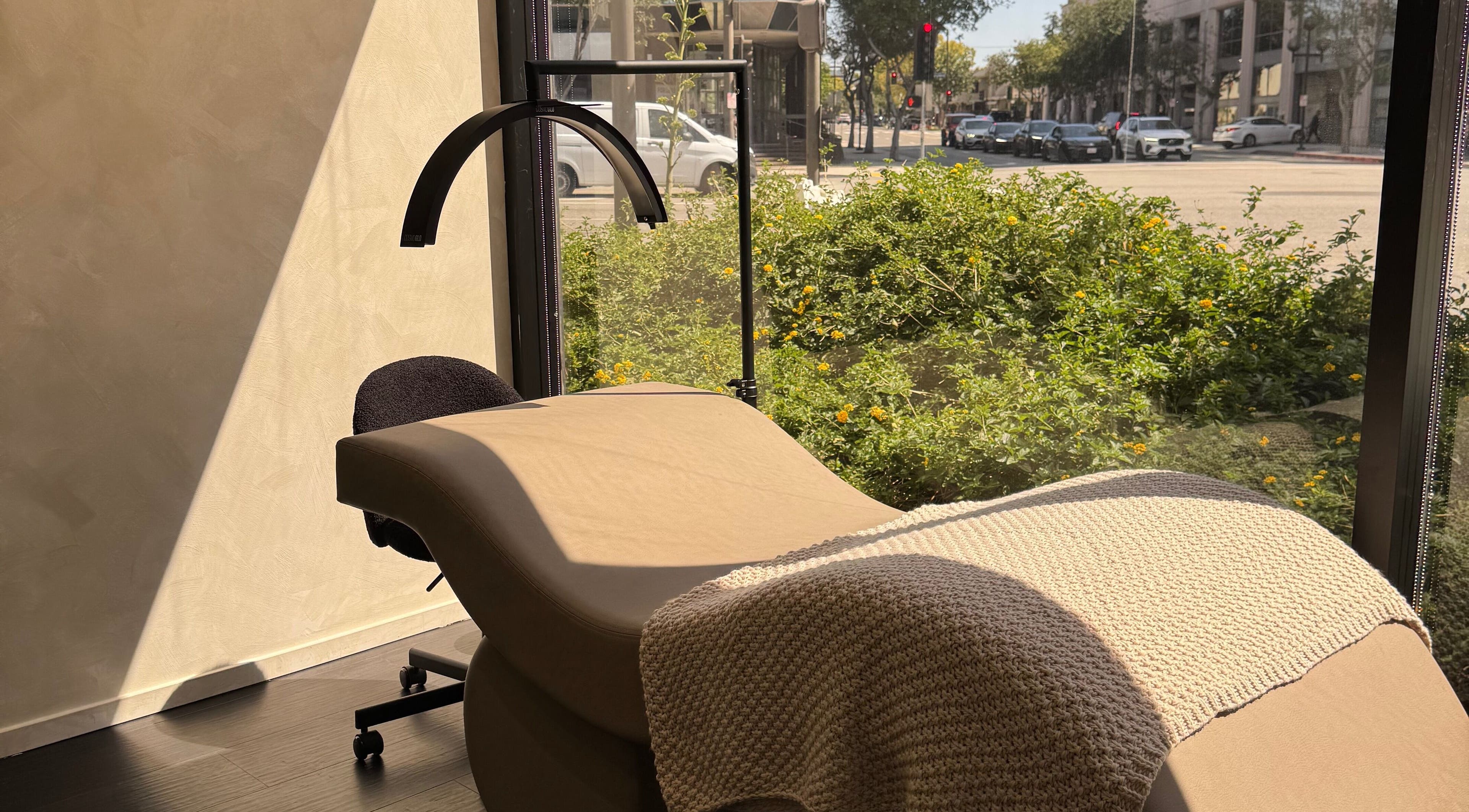 Relaxing treatment bed at Beauté De Mart, bathed in sunlight, Glendale, California, US.