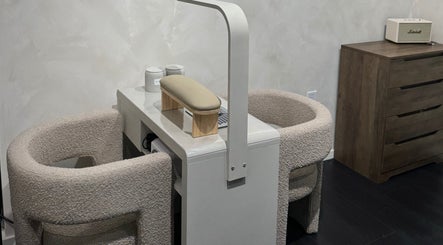 Modern nail care station at Beauté De Mart in Glendale, California, US, featuring plush seating and sleek design.