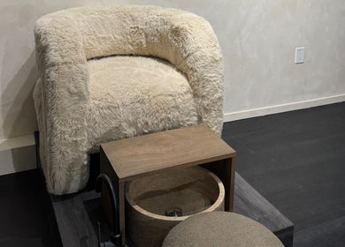 Luxurious pedicure chair with plush white fur at Beauté De Mart in Glendale, California, US.