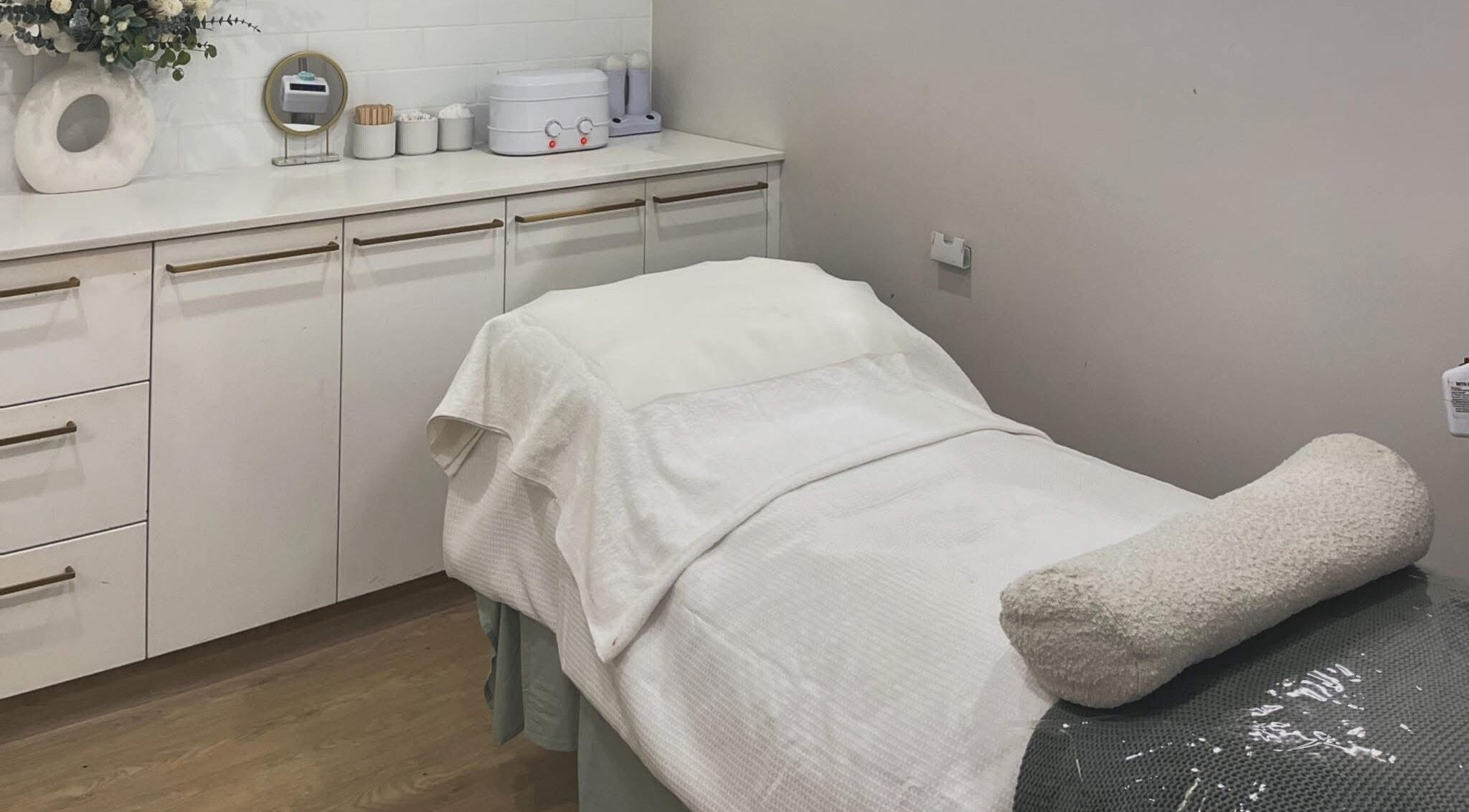 Serene massage room at Beauty Beyond Browz - Tuncurry, showcasing elegance in Tuncurry, New South Wales, AU.