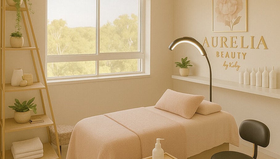 Relaxing treatment room at Beauty By Kelly, Boyne Island, Queensland, AU, featuring plush bed and stylish decor.