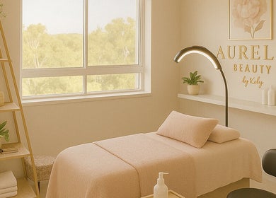Relaxing treatment room at Beauty By Kelly, Boyne Island, Queensland, AU, featuring plush bed and stylish decor.