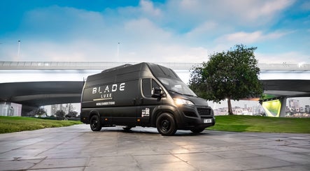 Blade Luxe mobile barber van parked in Abu Dhabi, Abu Dhabi, AE offering luxury beauty services.